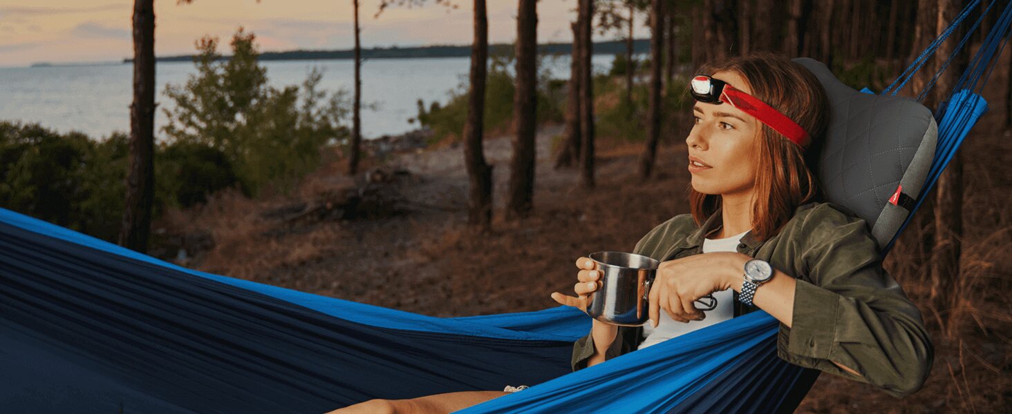 Hikenture pillow supporting a camper in a hammock