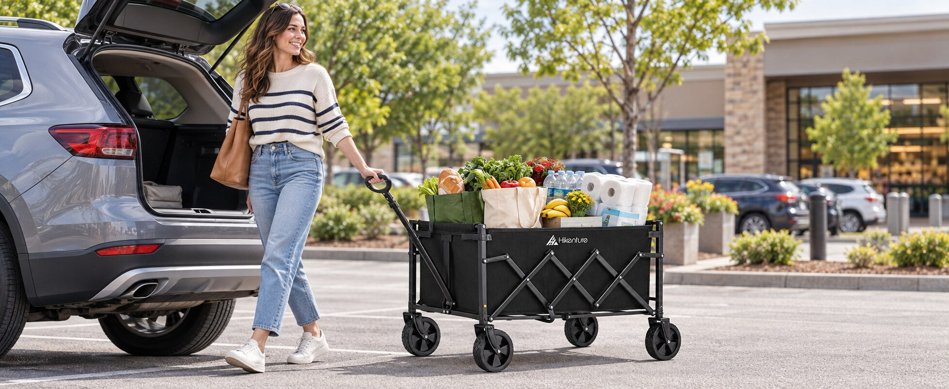 Hikenture folding wagon carrying groceries beside a compact SUV